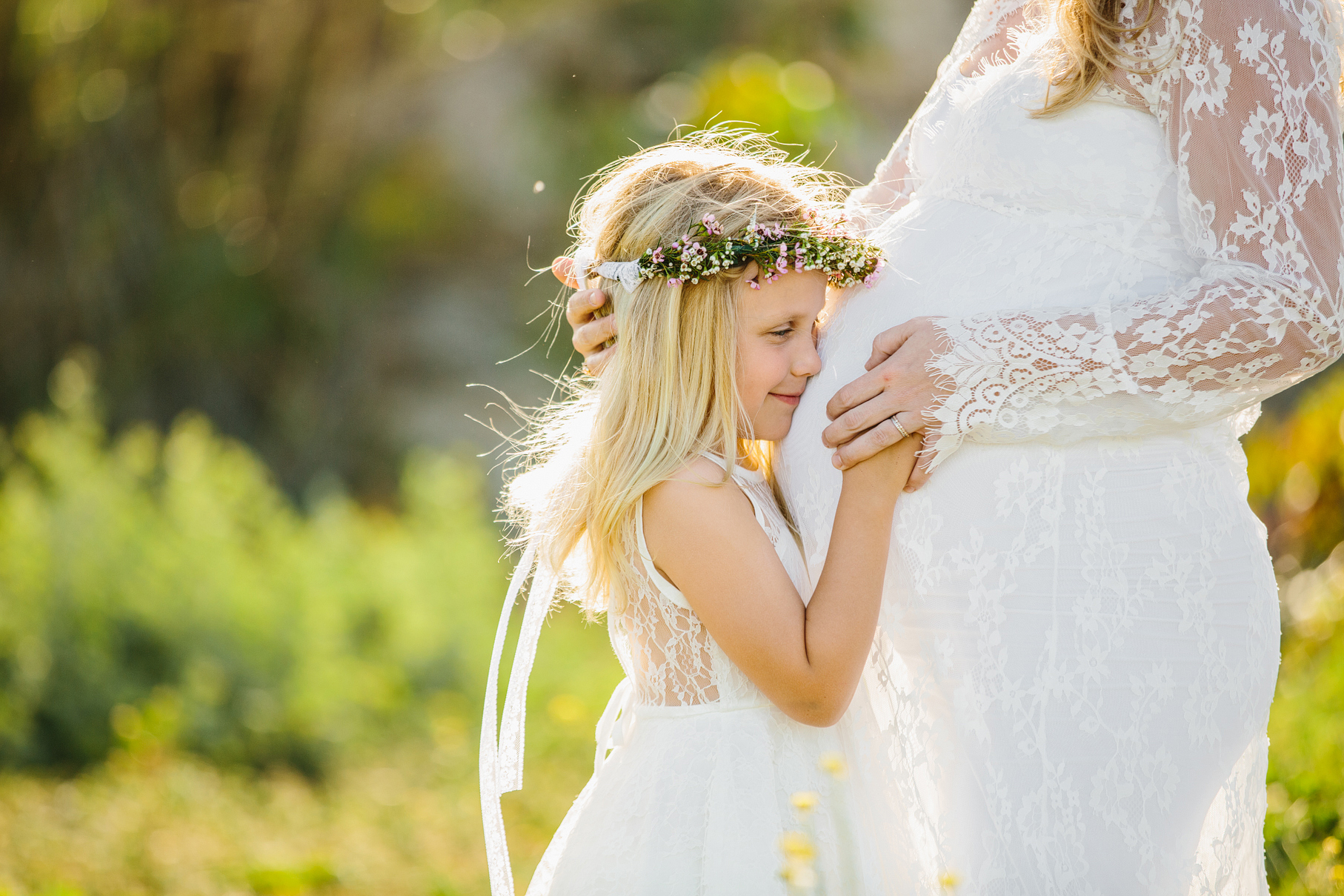 A maternity photography session in california with mother daughter their horse and a creek