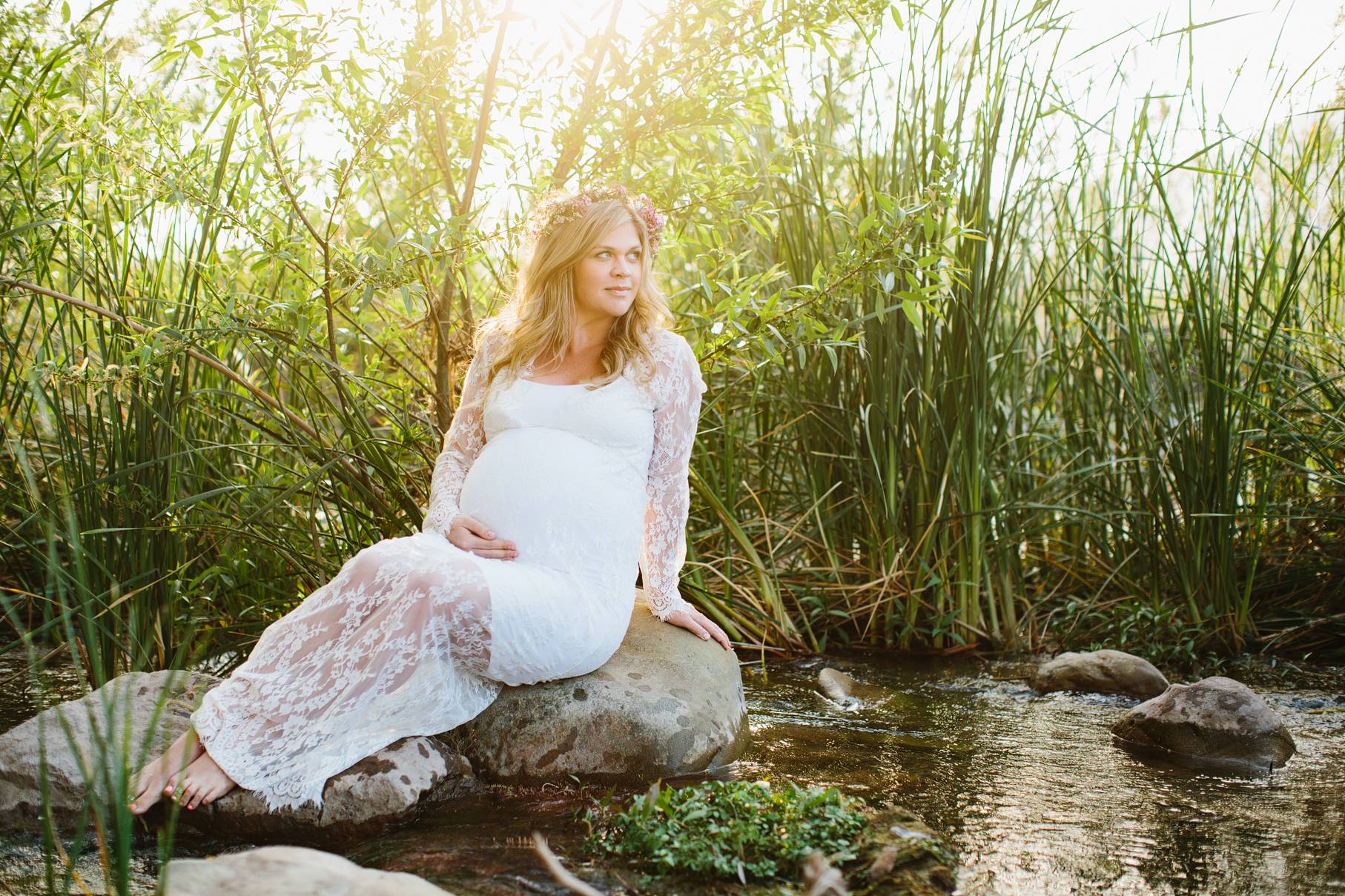 A maternity photography session in california with mother daughter their horse and a creek