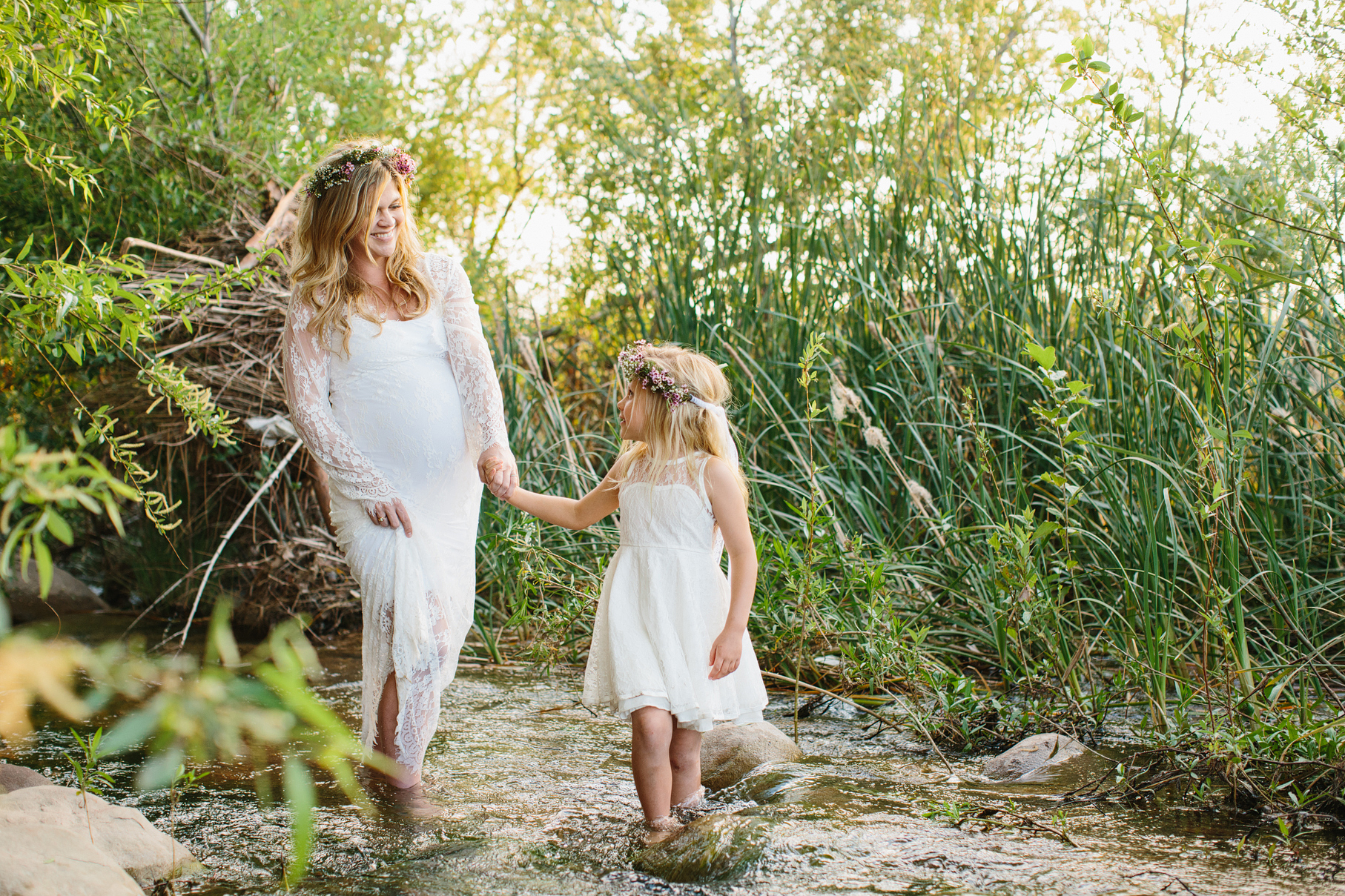 A maternity photography session in california with mother daughter their horse and a creek