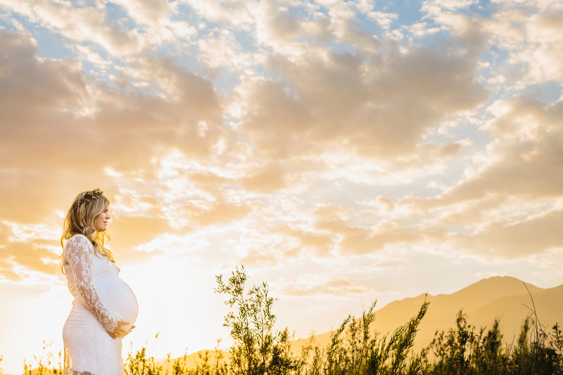 A maternity photography session in california with mother daughter their horse and a creek