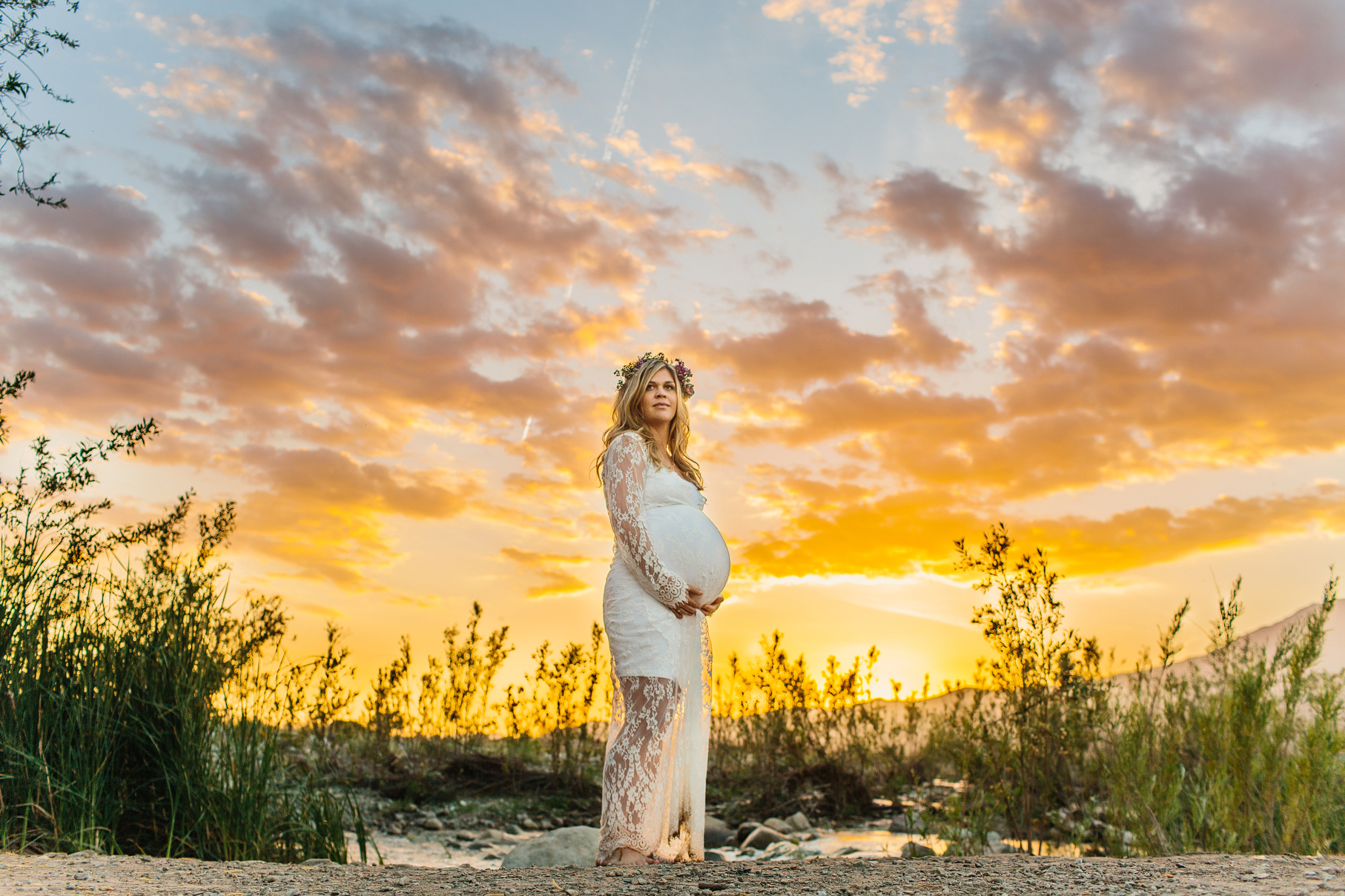 A maternity photography session in california with mother daughter their horse and a creek